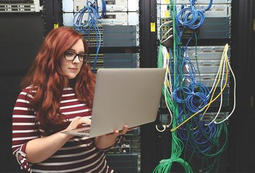 Female working on a computer in a computer server room